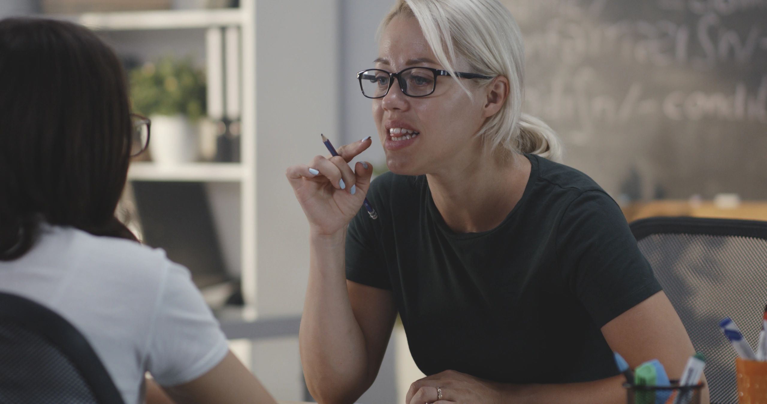 Coach and learner practicing pronunciation together