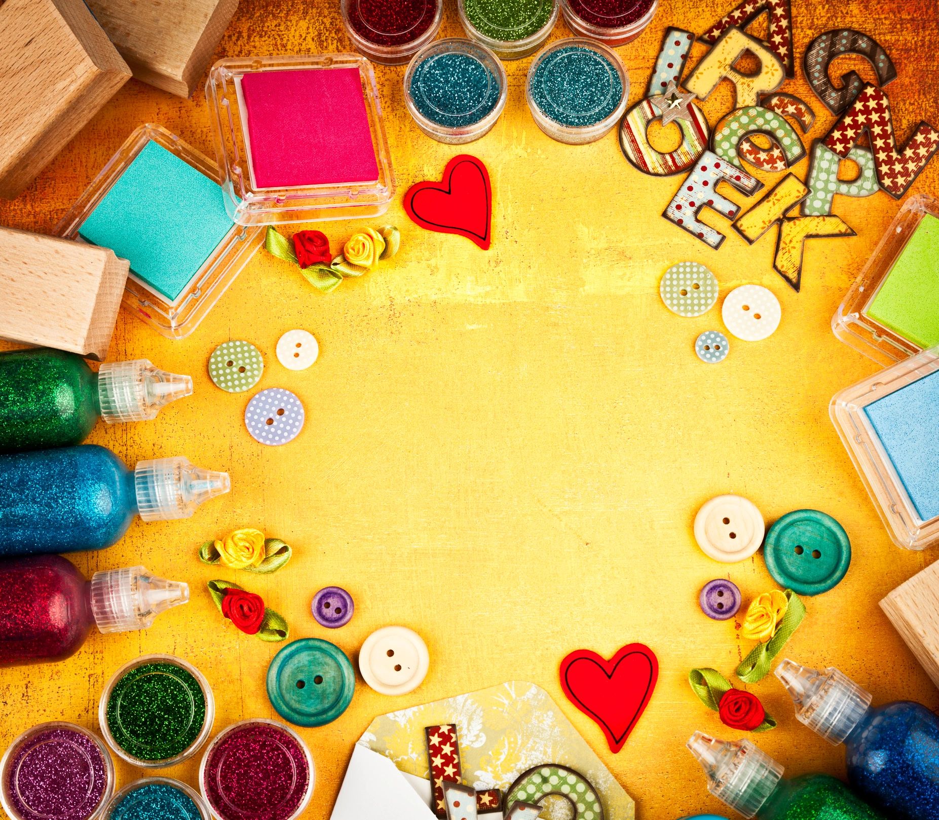 Scrapbooking and craft supplies arranged on a textured background