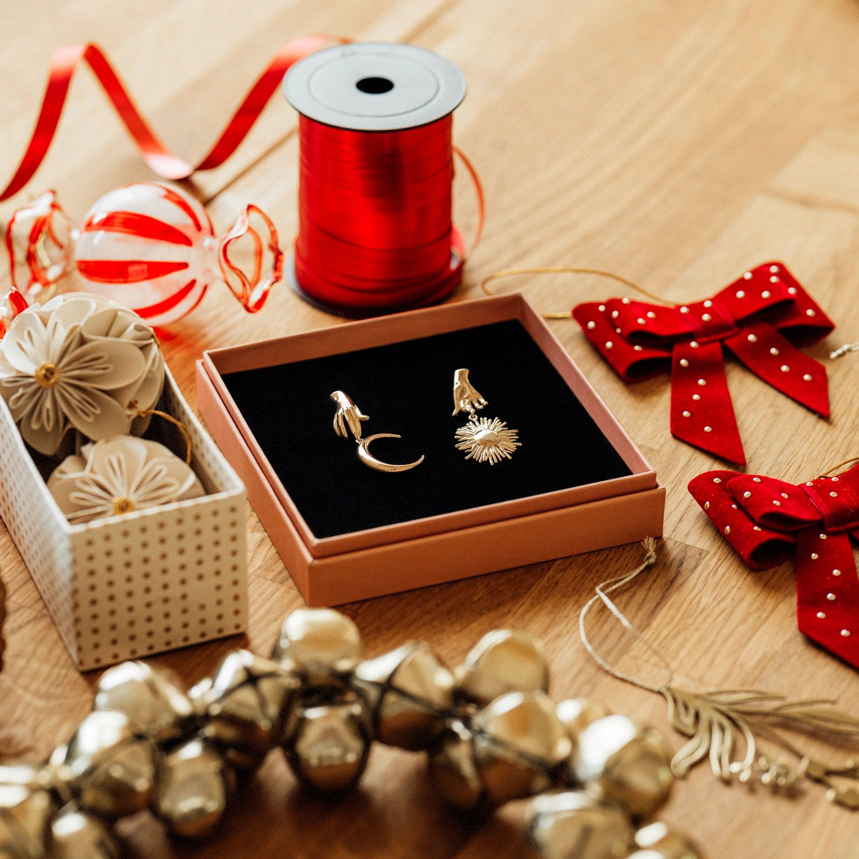 Gift wrapping flat lay with jewelry and festive details
